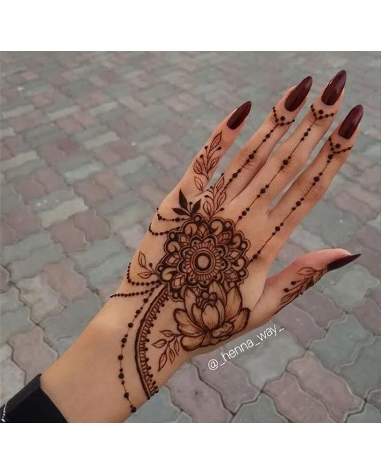 Band Inspired Radiant Back Hand Mehndi Design